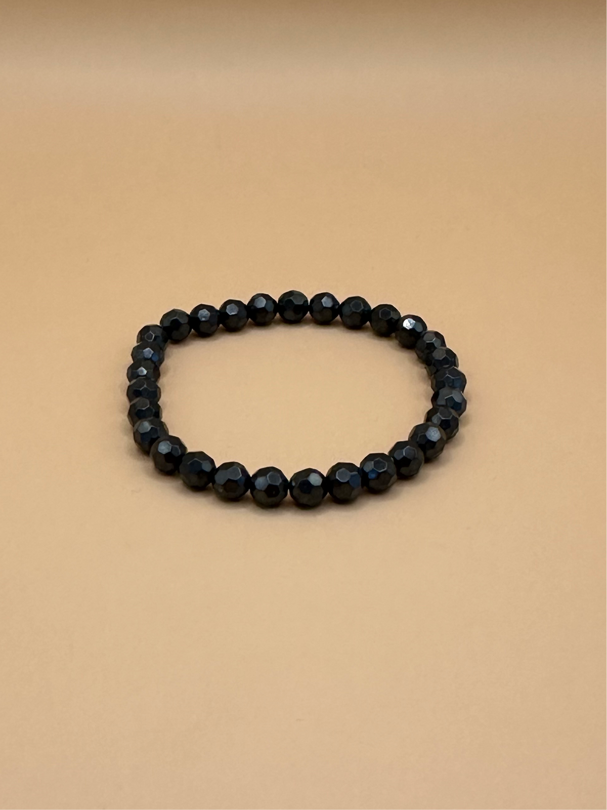 ARMBAND HÄMATIT FACETTIERT (6mm)