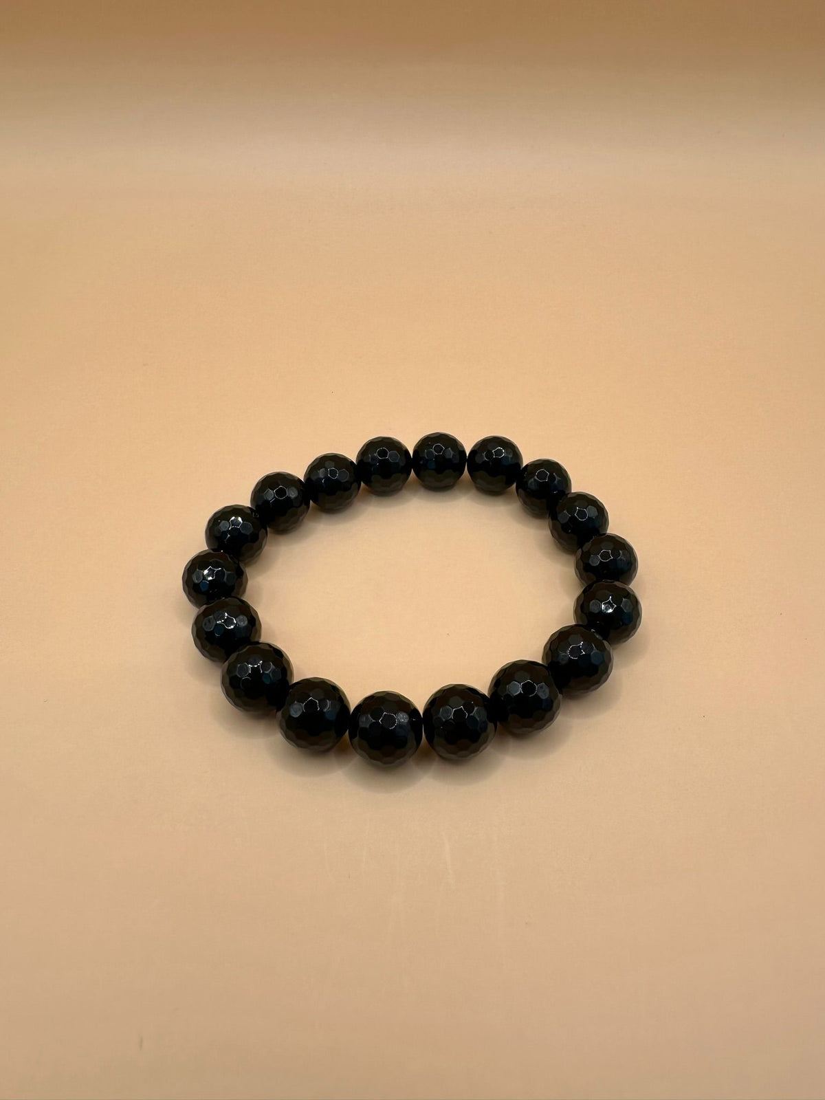 ARMBAND ONYX FACETTIERT (10mm)